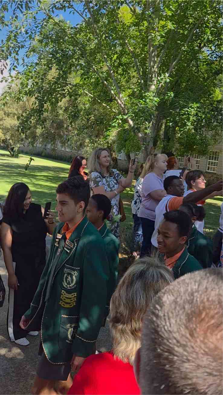 Parents and learners cheer the Matrics after the gate