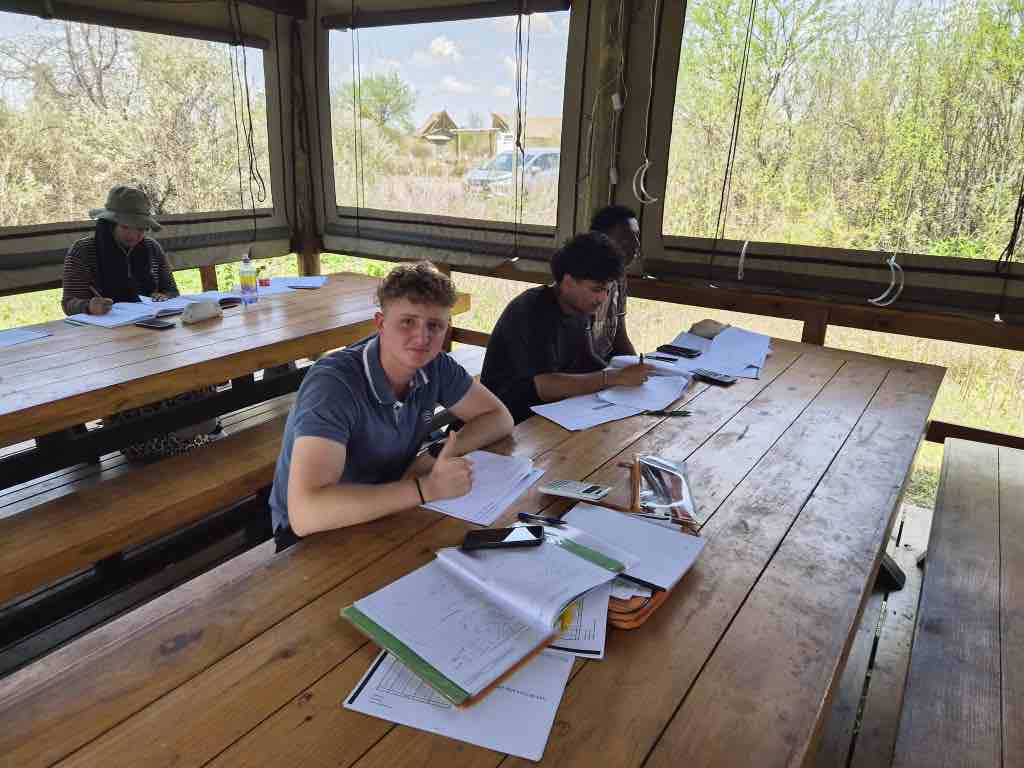 Learners working through past papers at the 2026 Mathematics Camp