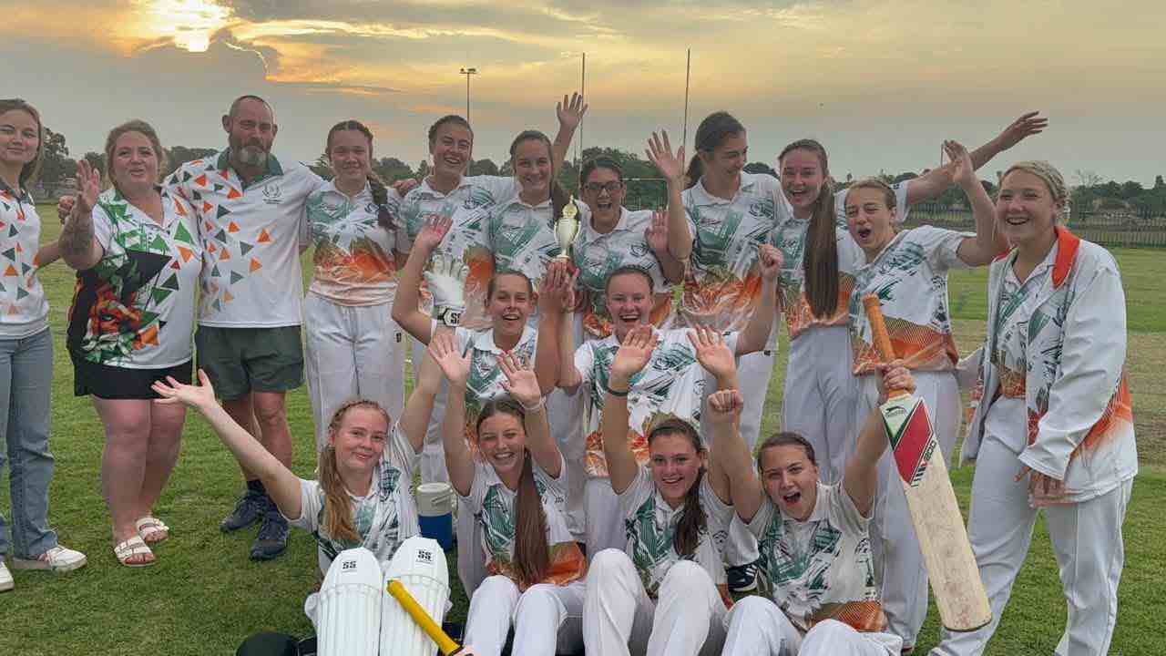 The girls cricket team celebrating their win in the final against Edenvale High